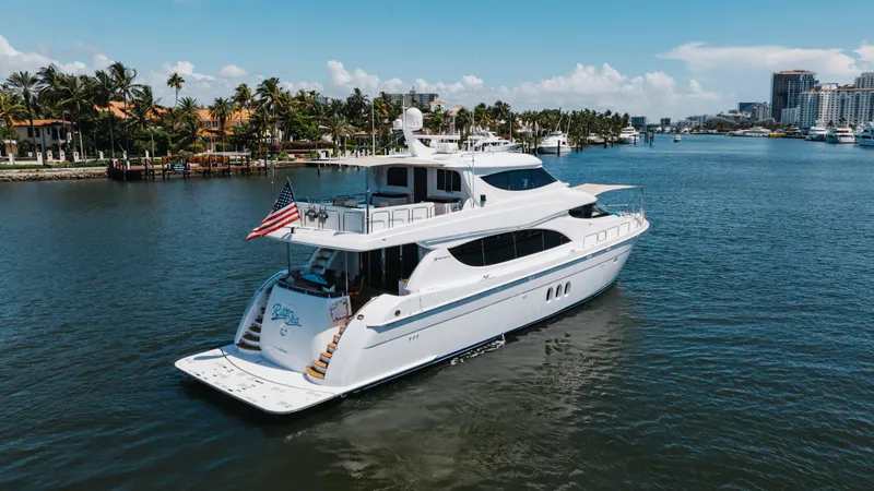 Ritz Sea Yacht Photos Pics 2014 Hatteras 80 Motor Yacht Sky Lounge cruising in a scenic waterway.