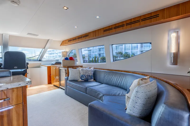 Ritz Sea Yacht Photos Pics Luxurious interior of 2014 Hatteras 80 Motor Yacht Sky Lounge with elegant seating and modern decor.