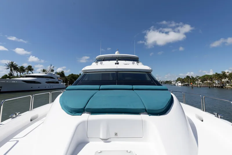 Ritz Sea Yacht Photos Pics 2014 Hatteras 80 Motor Yacht Sky Lounge on a sunny day, docked near palm trees.