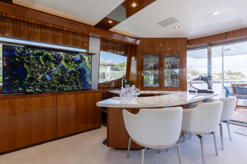 Ritz Sea Yacht Photos Pics Luxurious interior of 2014 Hatteras 80 Motor Yacht Sky Lounge with elegant dining area.