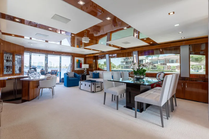 Ritz Sea Yacht Photos Pics Luxurious interior of 2014 Hatteras 80 Motor Yacht Sky Lounge with elegant dining area.