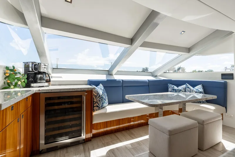 Ritz Sea Yacht Photos Pics Luxurious interior of 2014 Hatteras 80 Motor Yacht Sky Lounge with modern seating and amenities.