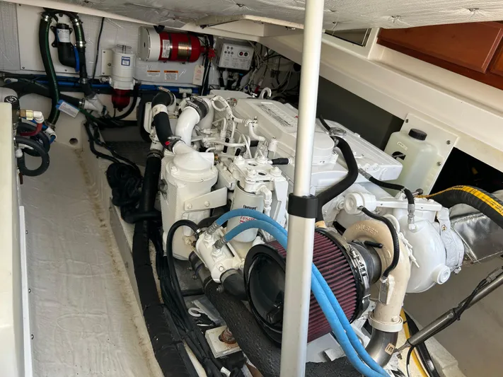 Islander Yacht Photos Pics Engine compartment of a 2018 Back Cove 32 boat, showcasing mechanical components and systems.