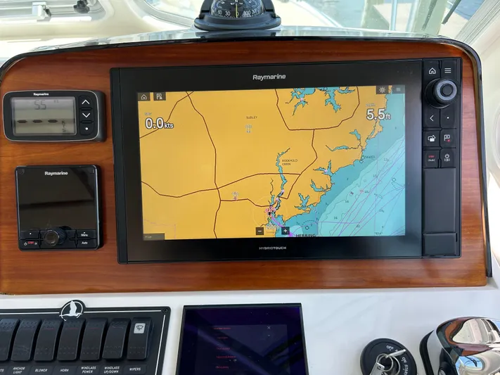Islander Yacht Photos Pics Navigation system on 2018 Back Cove 32 boat, featuring Raymarine display and controls.