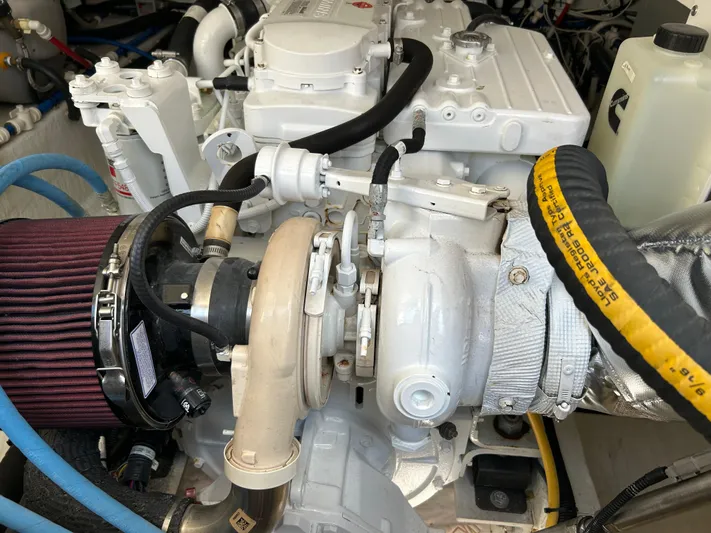 Islander Yacht Photos Pics Engine compartment of a 2018 Back Cove 32 boat, showcasing detailed mechanical components.