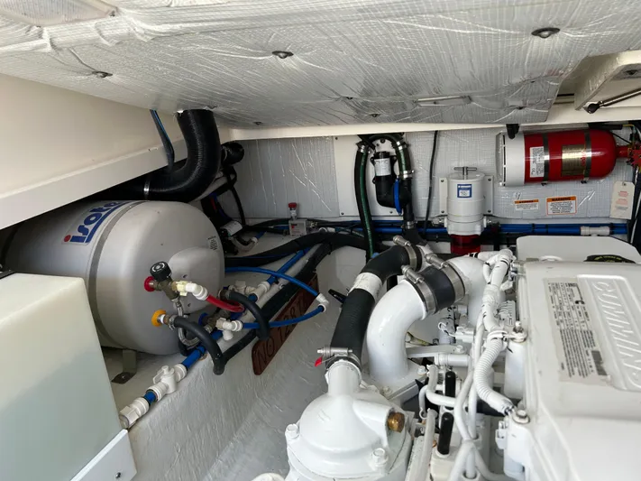 Islander Yacht Photos Pics Engine room of 2018 Back Cove 32 boat, featuring Cummins engine and Isotemp water heater.
