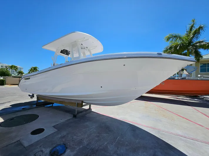  Yacht Photos Pics 2022 Century 2900 Center Console boat on display under clear blue sky.
