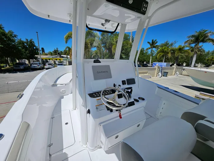  Yacht Photos Pics 2022 Century 2900 Center Console boat with modern helm and Garmin navigation system.