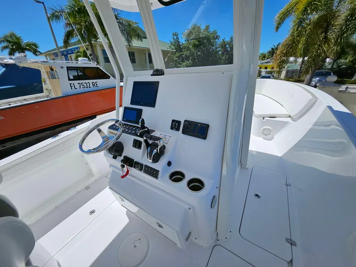  Yacht Photos Pics 2022 Century 2900 Center Console boat interior with modern dashboard and steering wheel.