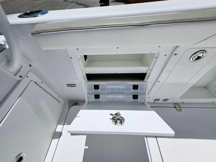  Yacht Photos Pics 2022 Century 2900 Center Console boat storage compartments and seating area.