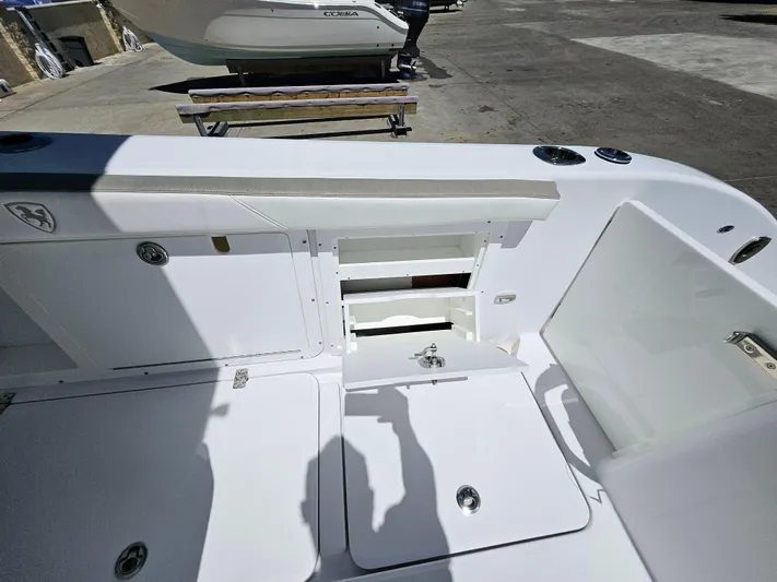  Yacht Photos Pics 2022 Century 2900 Center Console boat interior with open storage compartments.