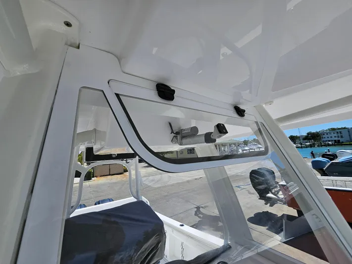  Yacht Photos Pics 2022 Century 2900 Center Console boat interior with open storage compartment.