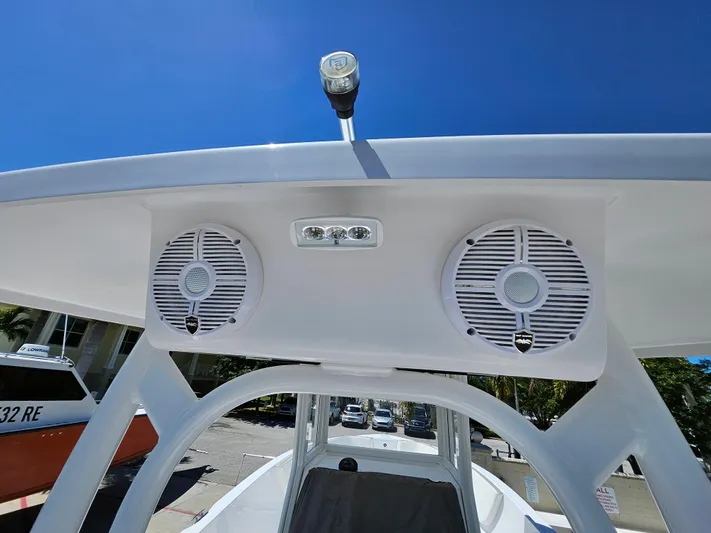  Yacht Photos Pics Century 2900 Center Console 2022 boat speakers and light under clear blue sky.