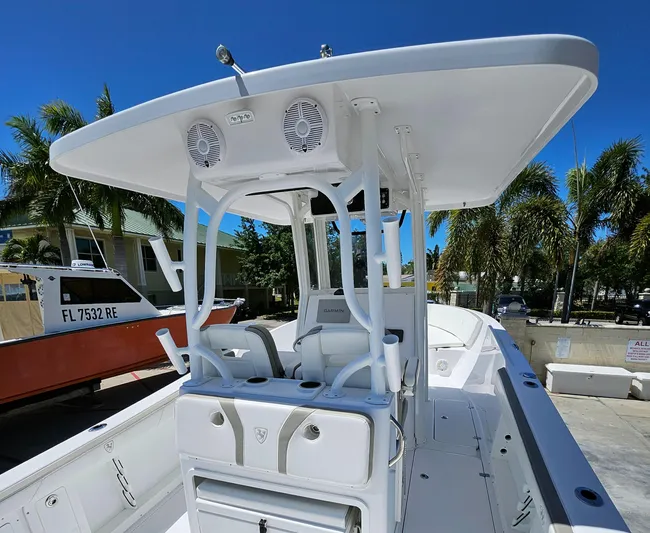  Yacht Photos Pics 2022 Century 2900 Center Console boat with T-top, docked under clear blue sky.