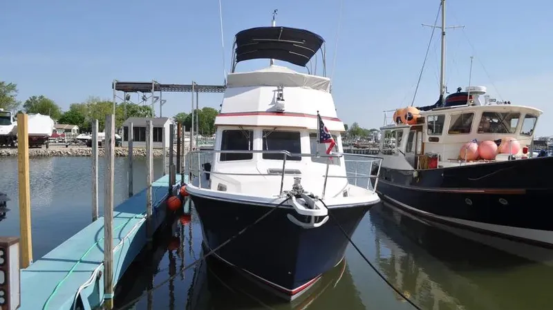 Raindance Yacht Photos Pics 1998 Sabre 36 Fast Trawler docked at marina, front view.