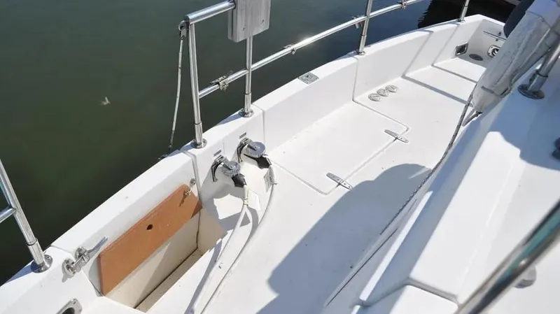 Raindance Yacht Photos Pics 1998 Sabre 36 Fast Trawler deck with railing and clean white surface.