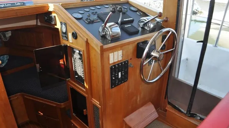 Raindance Yacht Photos Pics 1998 Sabre 36 Fast Trawler helm with wooden interior and navigation controls.