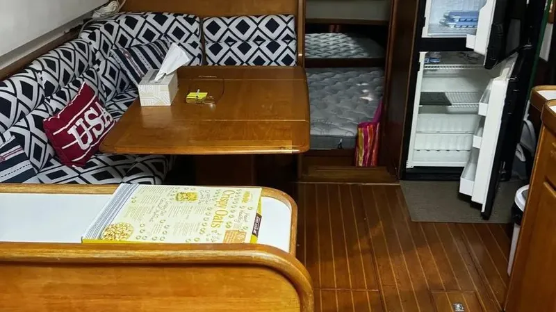 Raindance Yacht Photos Pics Interior of 1998 Sabre 36 Fast Trawler with wooden flooring and patterned seating.