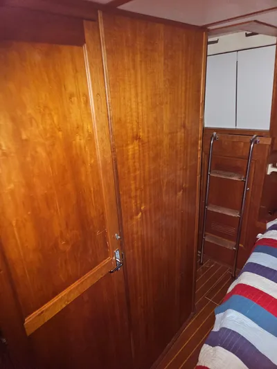 Raindance Yacht Photos Pics Interior of 1998 Sabre 36 Fast Trawler with wooden cabinetry and ladder.