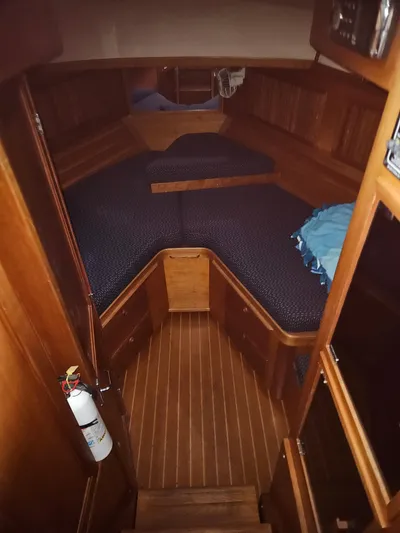 Raindance Yacht Photos Pics 1998 Sabre 36 Fast Trawler cabin with wooden interior and V-berth.