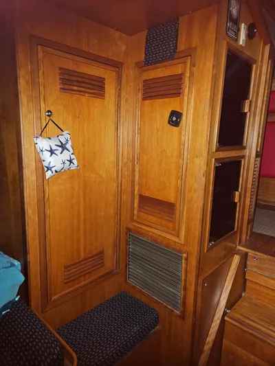 Raindance Yacht Photos Pics Interior of 1998 Sabre 36 Fast Trawler with wooden cabinetry and seating.