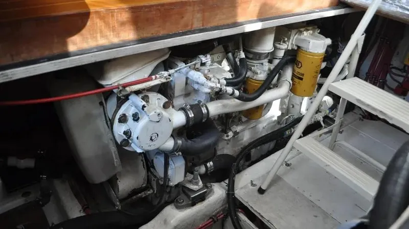 Raindance Yacht Photos Pics Engine compartment of 1998 Sabre 36 Fast Trawler, showcasing mechanical components and filters.