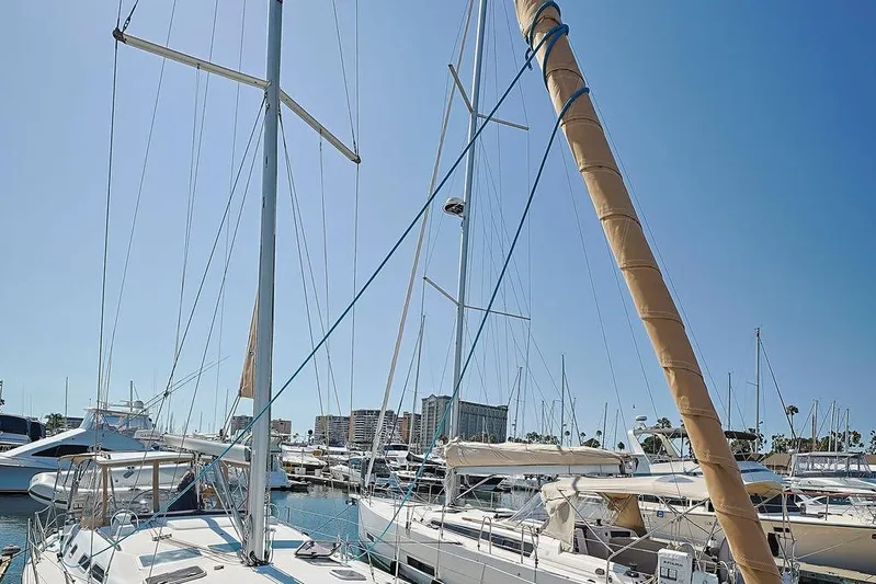 Mustang III Yacht Photos Pics 2007 Beneteau Oceanis 423 sailboat docked in a sunny marina.