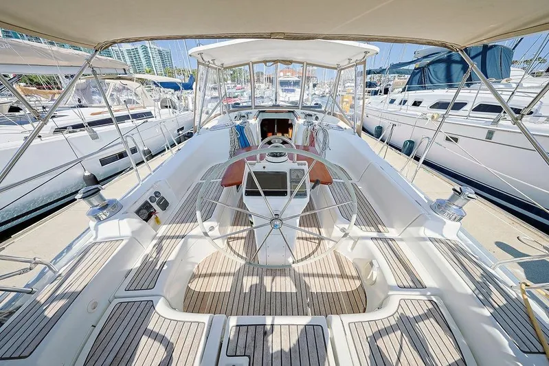 Mustang III Yacht Photos Pics 2007 Beneteau Oceanis 423 yacht cockpit with steering wheel, docked in marina.