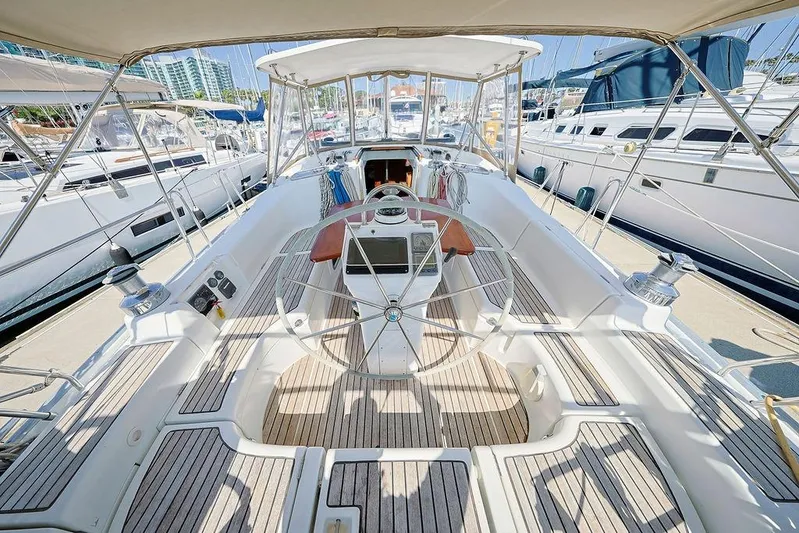 Mustang III Yacht Photos Pics Cockpit view of 2007 Beneteau Oceanis 423 yacht, featuring a spacious helm and teak decking.