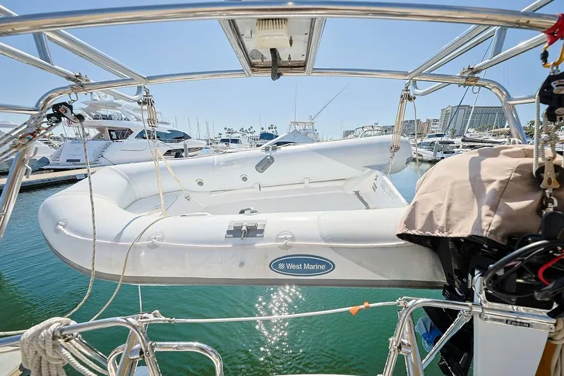 Mustang III Yacht Photos Pics Beneteau Oceanis 423 (2007) with West Marine dinghy at marina, sunny day.