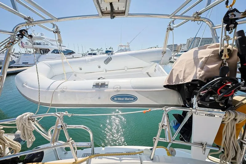 Mustang III Yacht Photos Pics Beneteau Oceanis 423 sailboat with West Marine dinghy, docked in a sunny marina, 2007 model.