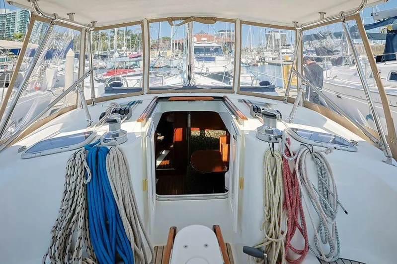 Mustang III Yacht Photos Pics 2007 Beneteau Oceanis 423 sailboat cockpit with ropes and marina view.