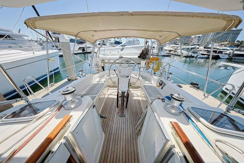 Mustang III Yacht Photos Pics 2007 Beneteau Oceanis 423 sailboat cockpit with canopy, docked in marina.