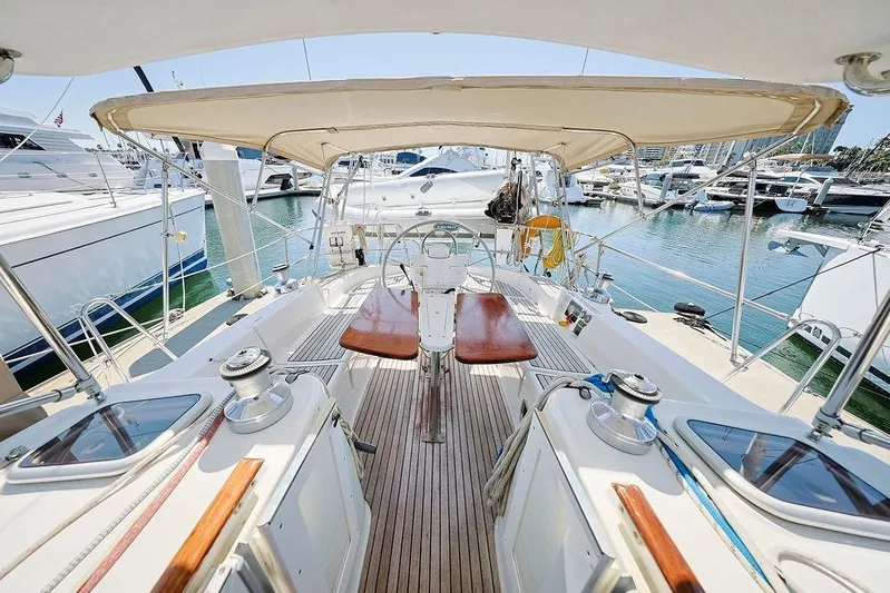 Mustang III Yacht Photos Pics 2007 Beneteau Oceanis 423 yacht cockpit with canopy, docked in marina.