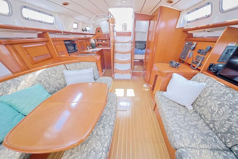 Mustang III Yacht Photos Pics Interior of 2007 Beneteau Oceanis 423 yacht with elegant wood finish and cozy seating.