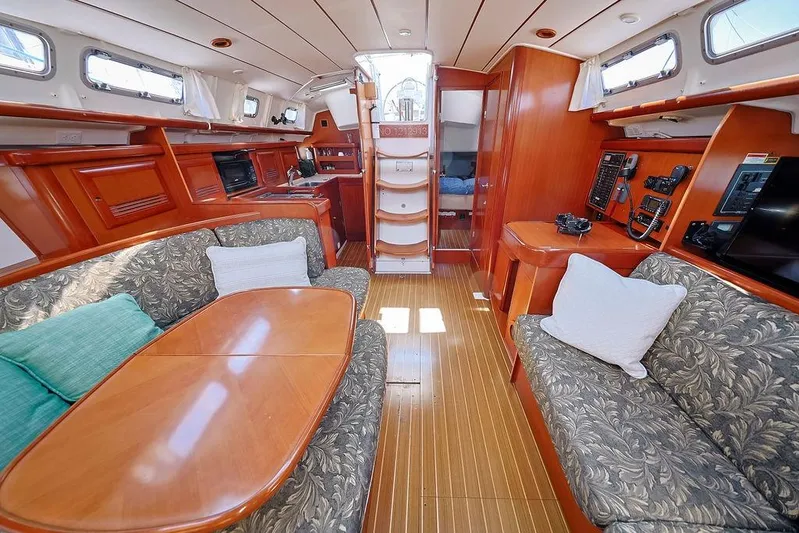 Mustang III Yacht Photos Pics Interior of 2007 Beneteau Oceanis 423 yacht with elegant wood finish and cozy seating.