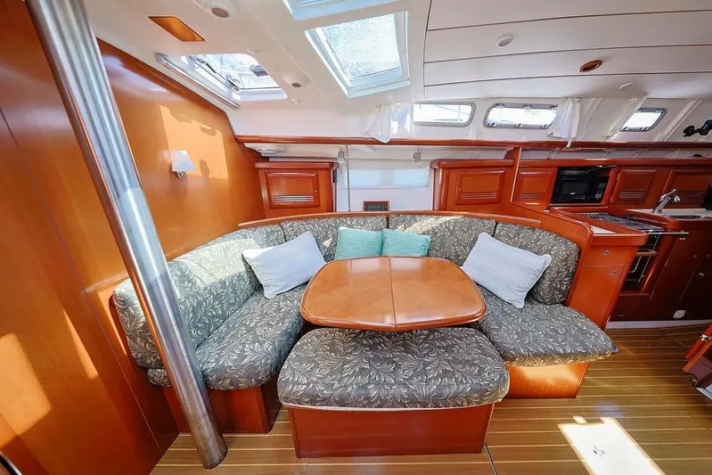 Mustang III Yacht Photos Pics Interior of 2007 Beneteau Oceanis 423 yacht with cozy seating and wooden finishes.