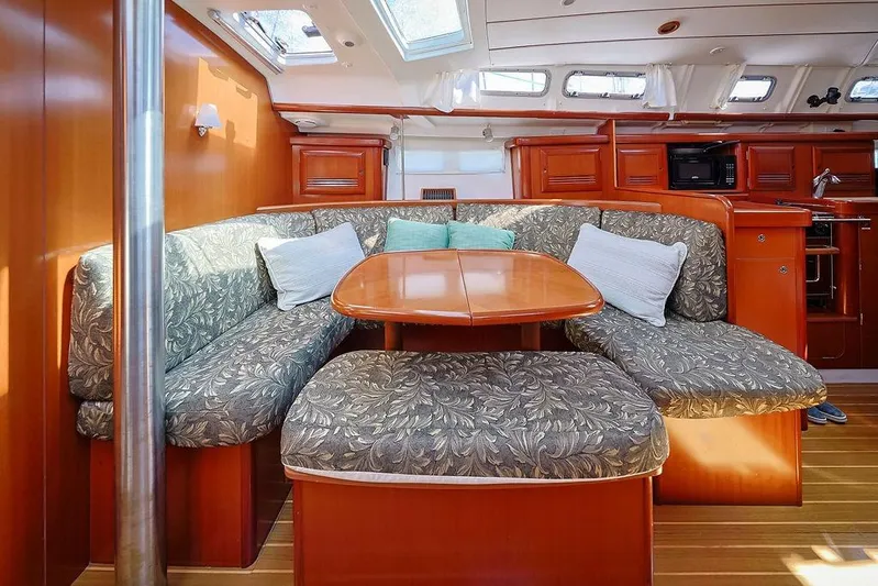 Mustang III Yacht Photos Pics Interior of 2007 Beneteau Oceanis 423 yacht with cozy seating and wooden finishes.