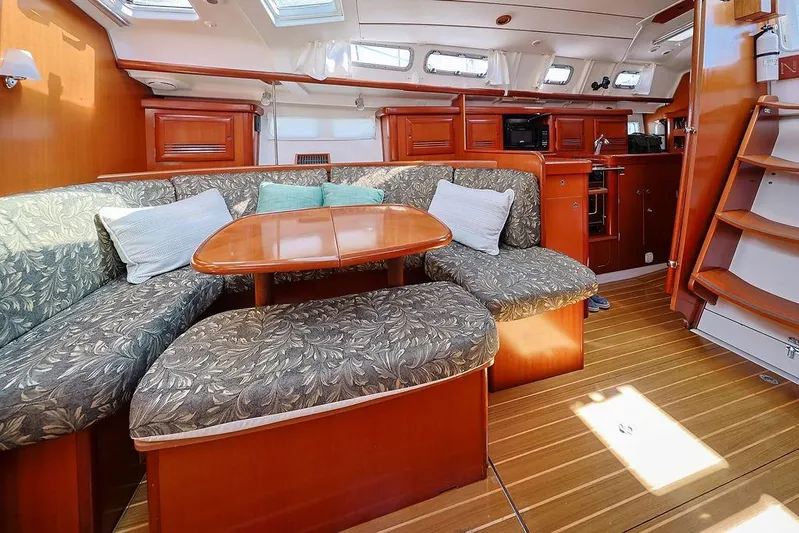 Mustang III Yacht Photos Pics Interior of 2007 Beneteau Oceanis 423 yacht with cozy seating and wooden finishes.
