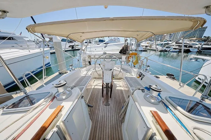 Mustang III Yacht Photos Pics 2007 Beneteau Oceanis 423 sailboat cockpit with helm, docked in marina.