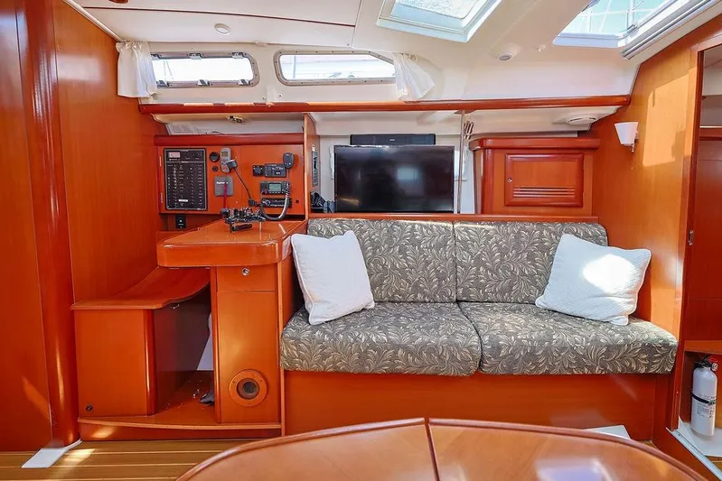 Mustang III Yacht Photos Pics Interior of 2007 Beneteau Oceanis 423 yacht with cozy seating and navigation equipment.