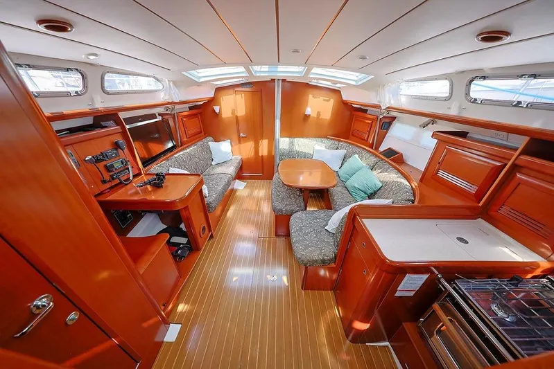 Mustang III Yacht Photos Pics Interior of 2007 Beneteau Oceanis 423 yacht with wood finish and cozy seating area.