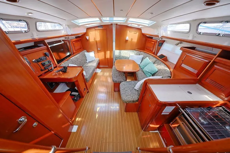 Mustang III Yacht Photos Pics Interior of 2007 Beneteau Oceanis 423 yacht with wood finish and cozy seating area.