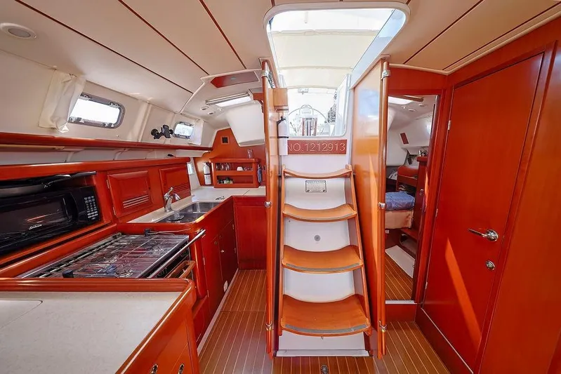 Mustang III Yacht Photos Pics Interior of 2007 Beneteau Oceanis 423 yacht, featuring a well-equipped kitchen and cozy cabin.