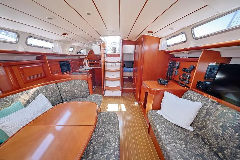 Mustang III Yacht Photos Pics Interior of 2007 Beneteau Oceanis 423 sailboat with wood finish and cozy seating.