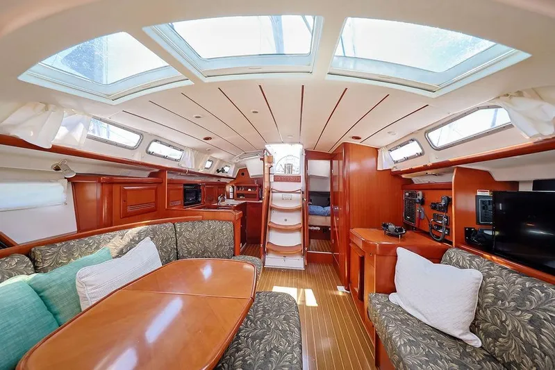 Mustang III Yacht Photos Pics Interior of 2007 Beneteau Oceanis 423 yacht with skylights, wood finish, and cozy seating.