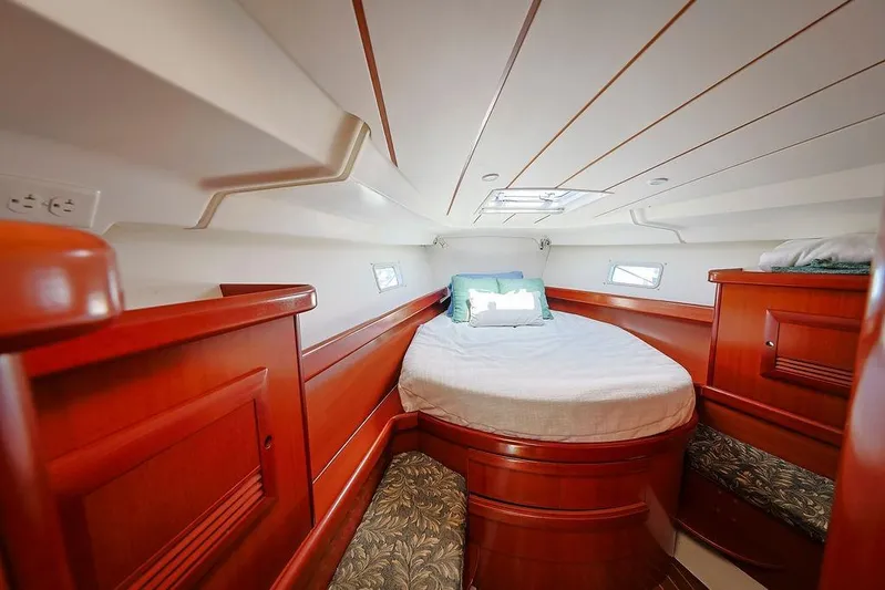 Mustang III Yacht Photos Pics Luxurious cabin interior of 2007 Beneteau Oceanis 423 sailboat with wooden finish.