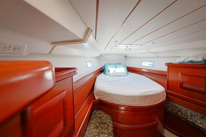 Mustang III Yacht Photos Pics Luxurious cabin interior of 2007 Beneteau Oceanis 423 yacht with wooden finish.