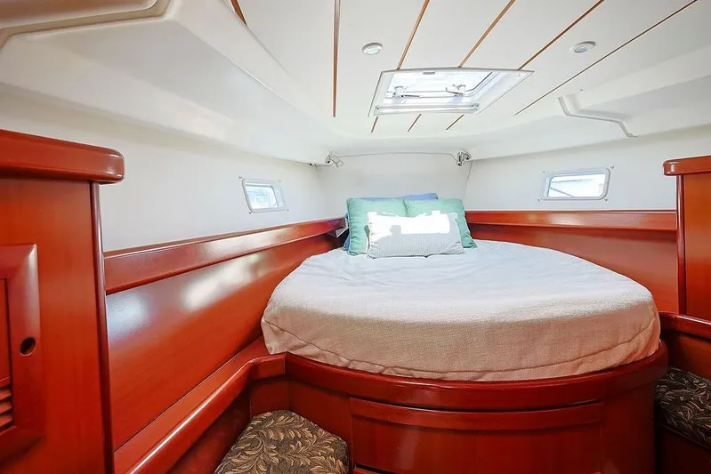 Mustang III Yacht Photos Pics Luxurious cabin interior of 2007 Beneteau Oceanis 423 yacht with cozy bedding.