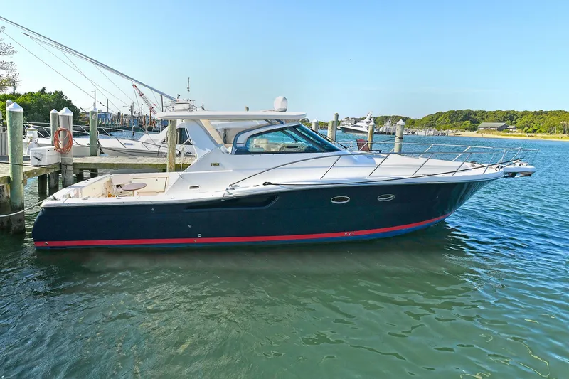 Spirit Yacht Photos Pics 2008 Tiara Yachts 4200 Open docked in a serene marina setting.